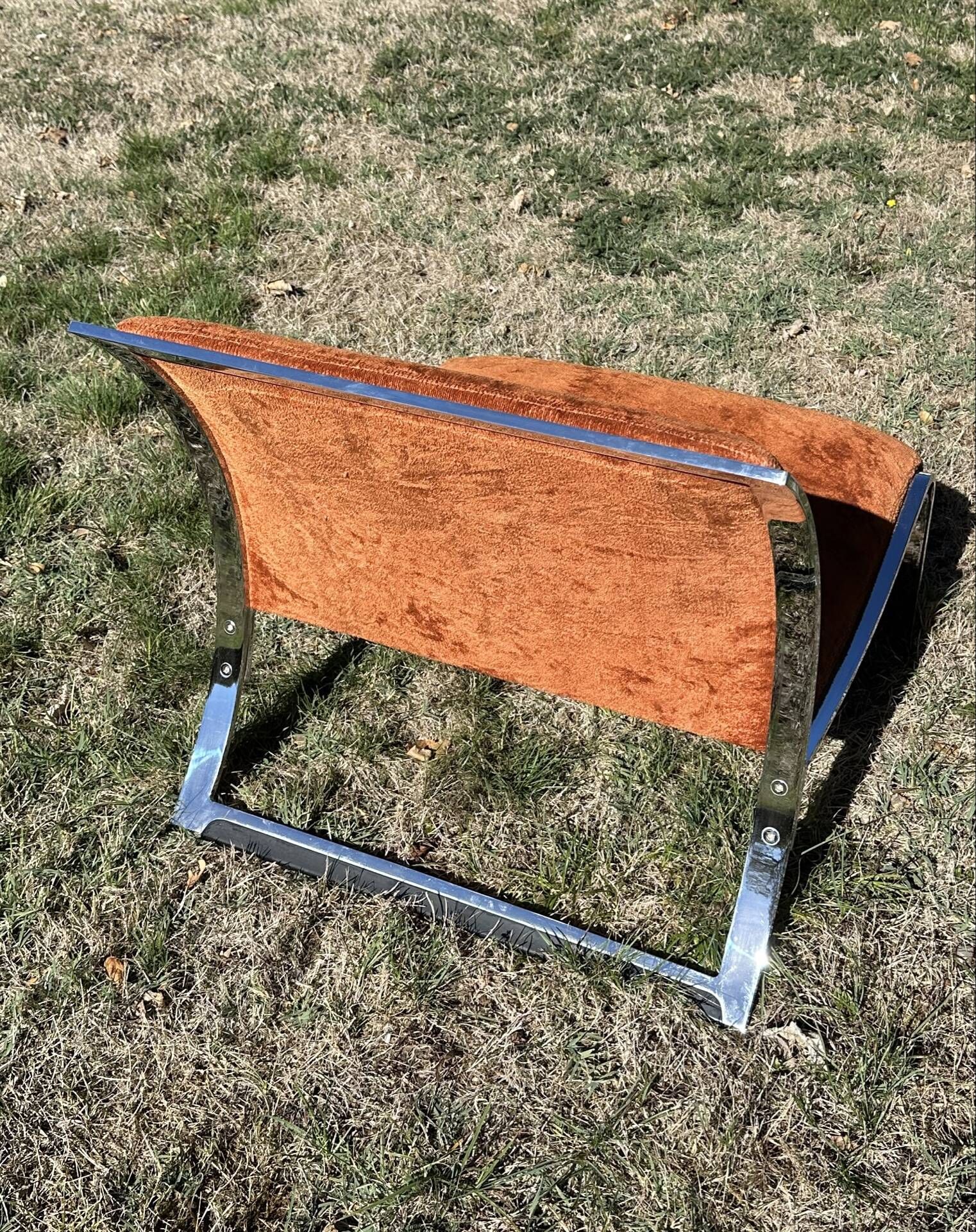 Chrome steel armchair and orange fabric by Vittorio Introini