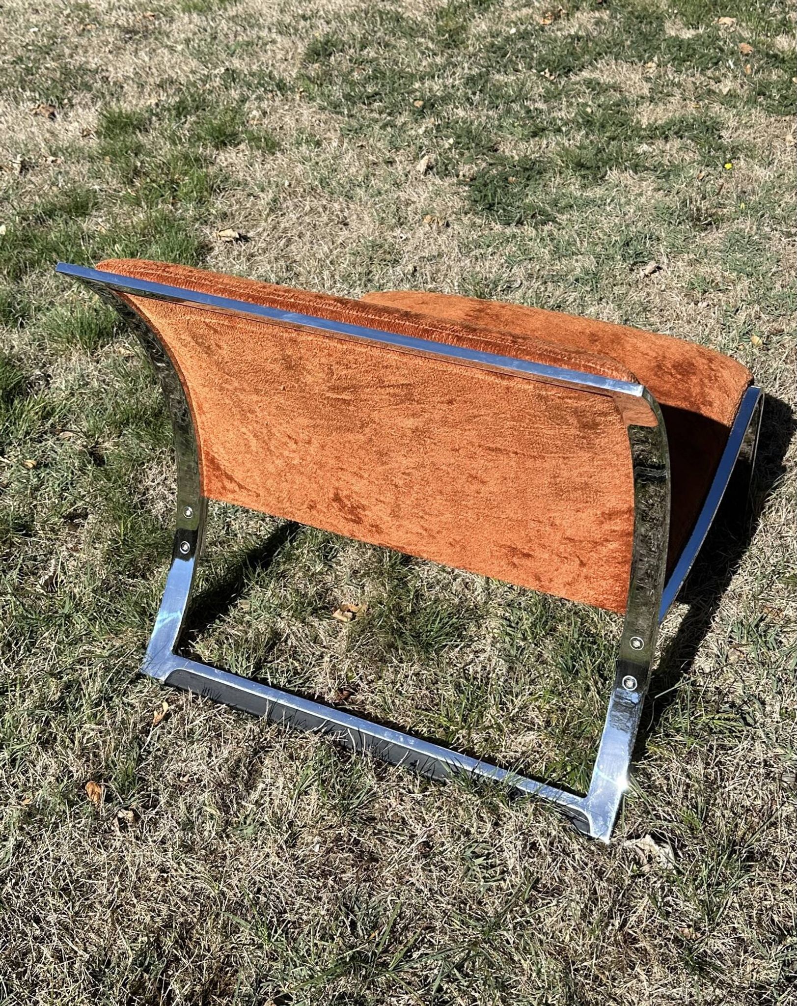 Chrome steel armchair and orange fabric by Vittorio Introini