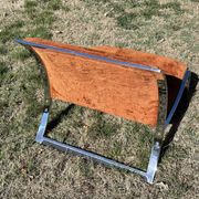 Chrome steel armchair and orange fabric by Vittorio Introini