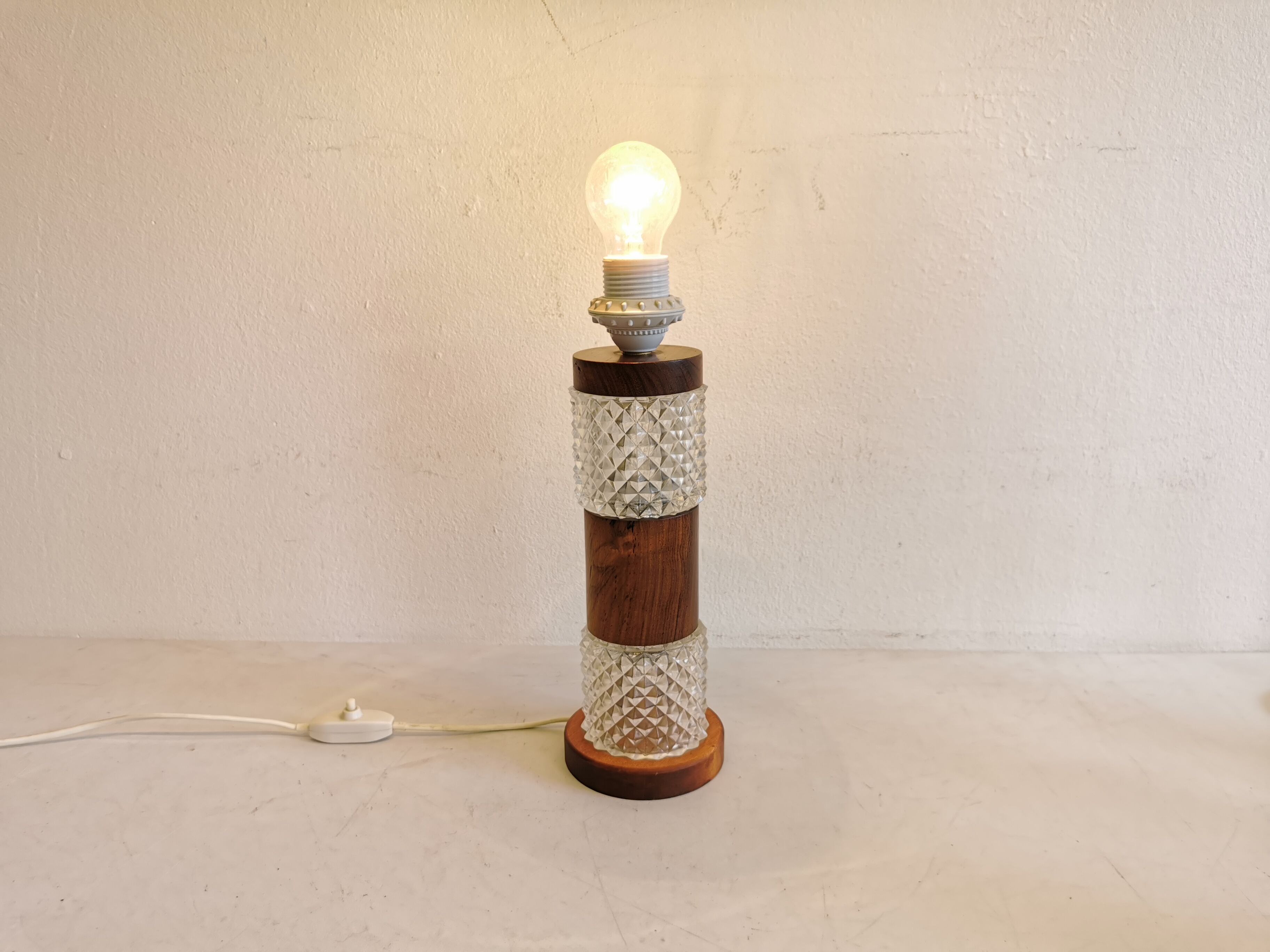 Swedish table lamp, made of what looks like rosewood and crystal glass.