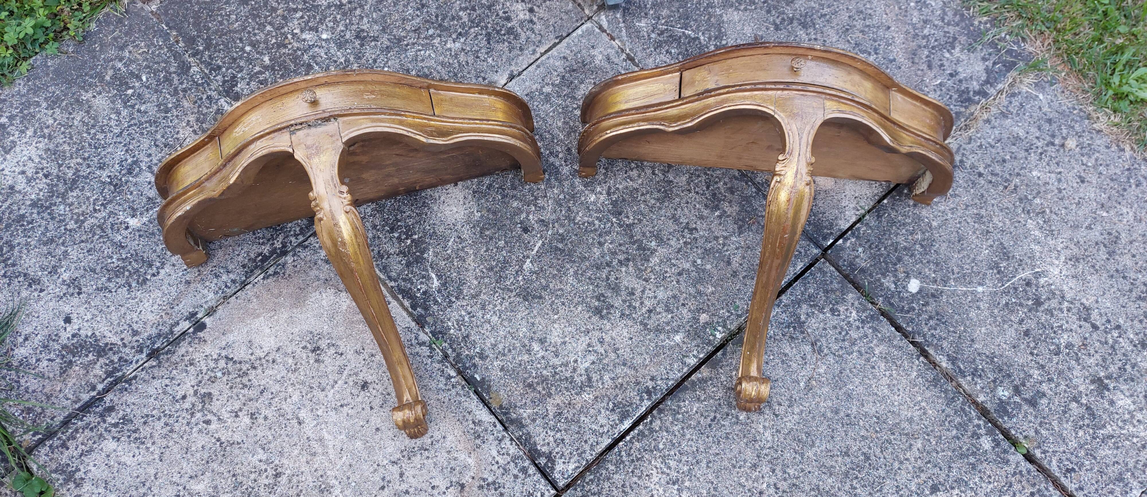 Golden patinated wall consoles