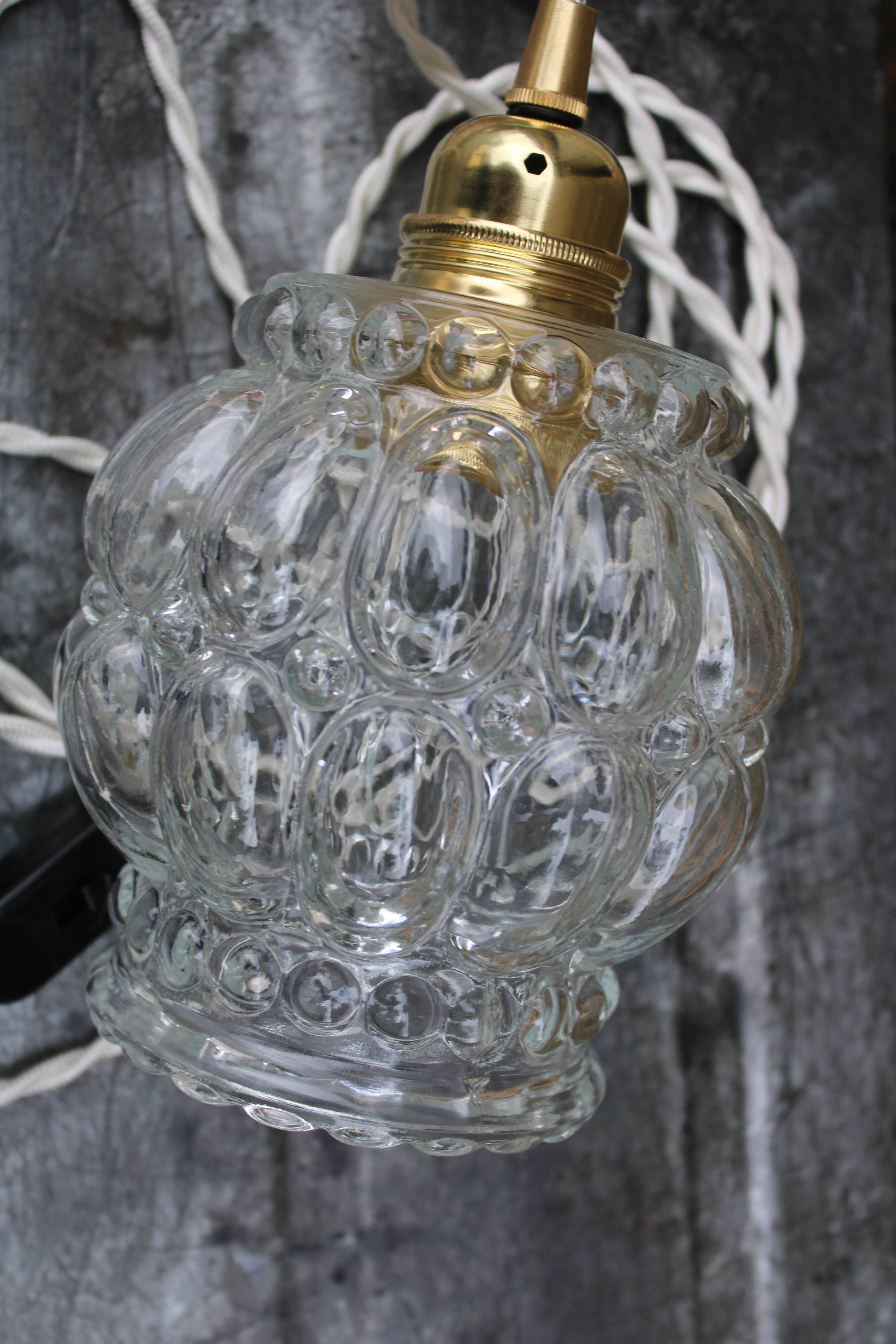 Moulded glass globe hand lamp