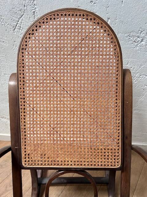 Curved wooden rocking chair