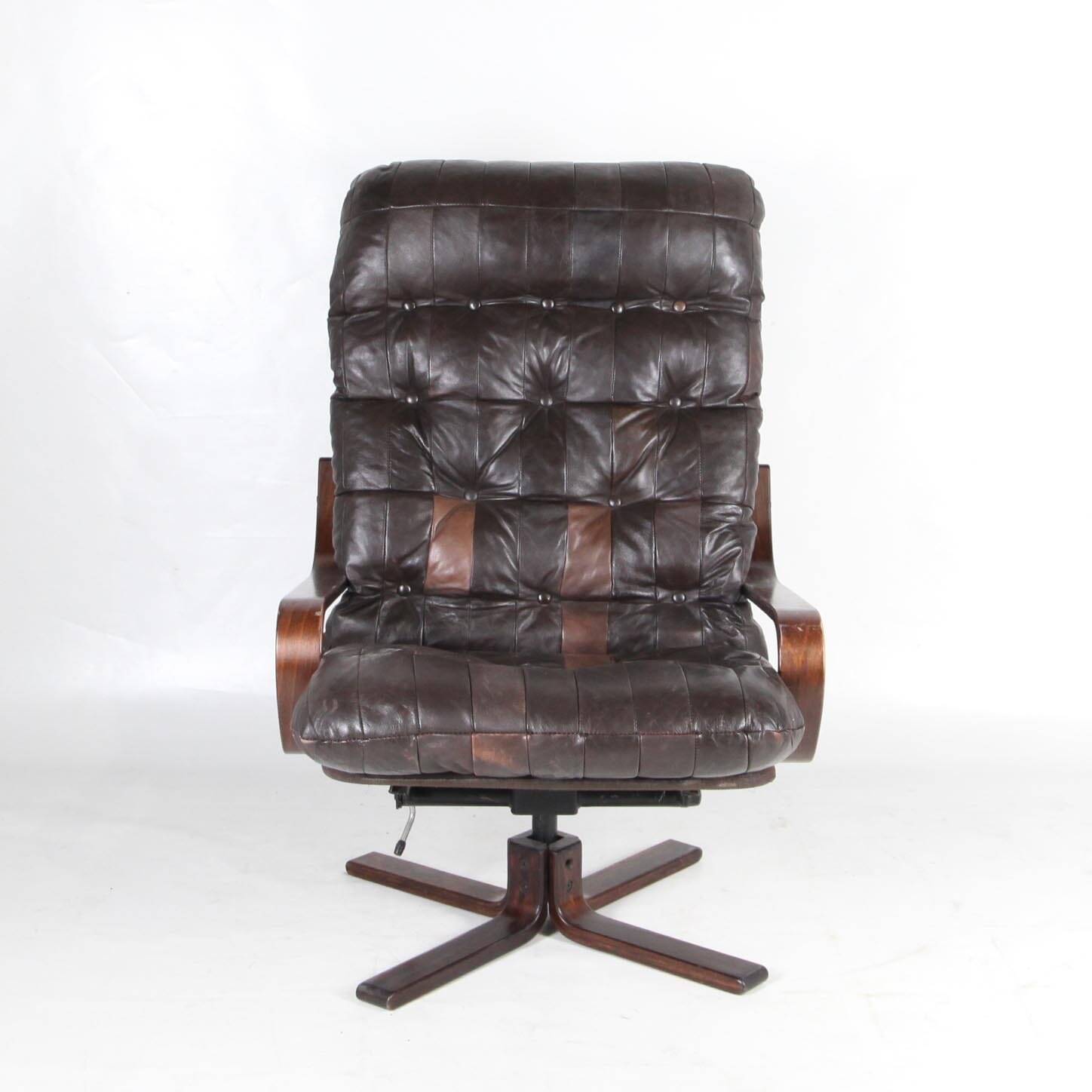 Vintage wooden and leather armchair