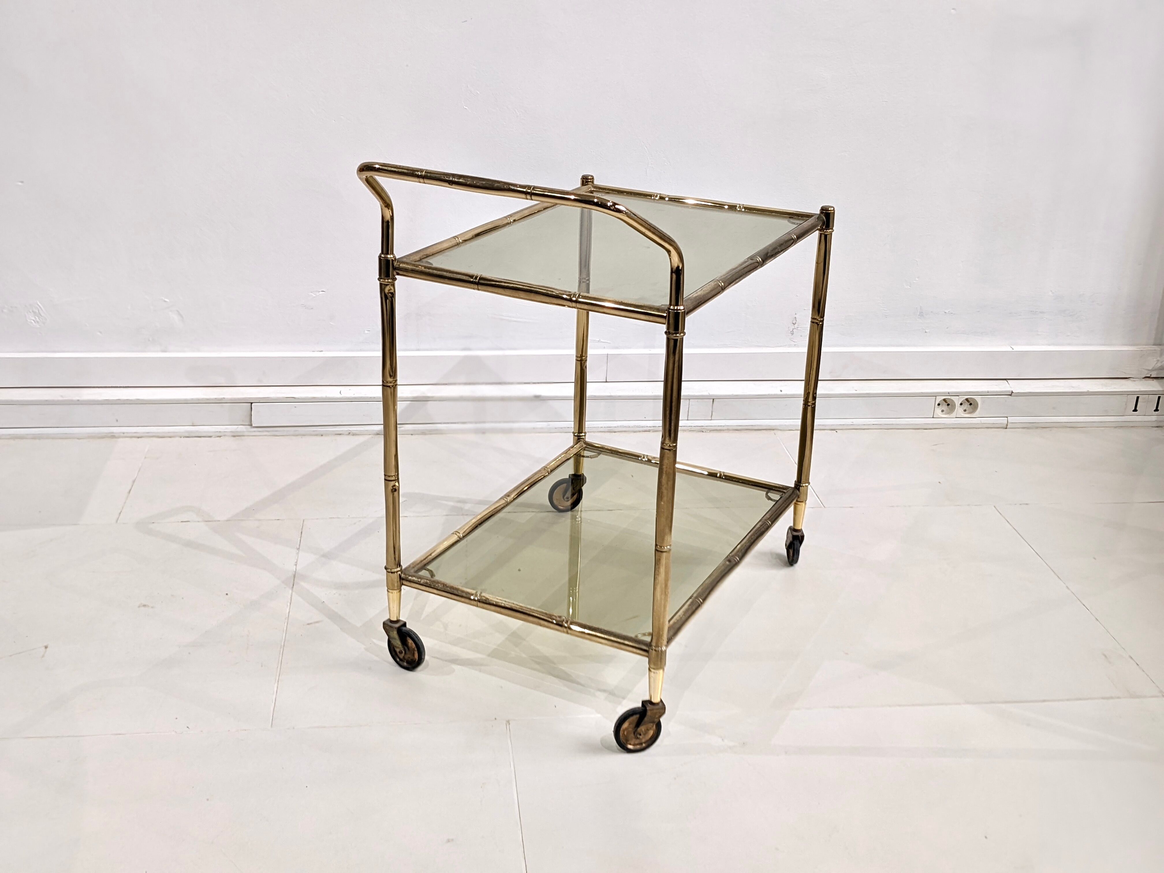 Golden metal dessert with tinted glass tops