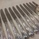 12 silver-plated dessert knives by St Medard, rocaille style, Florian.