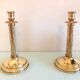 Pair of empire style brass candlesticks