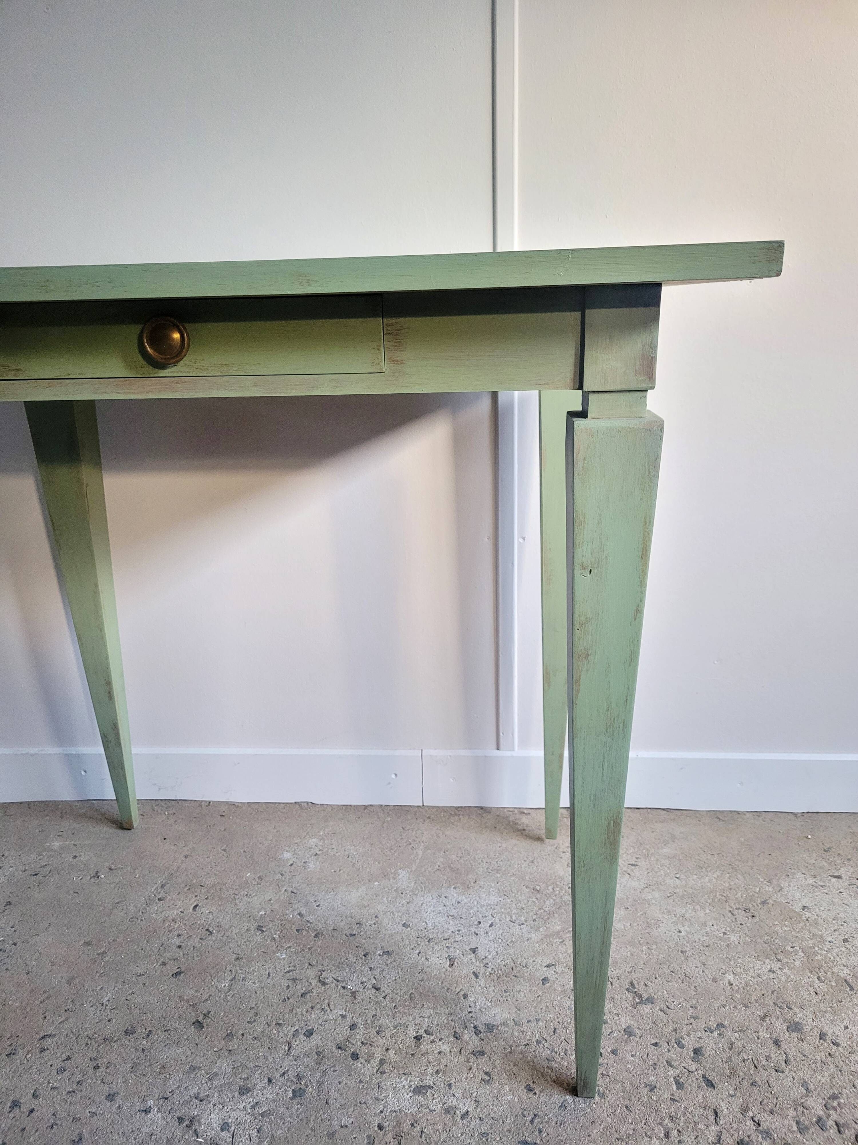 Green side table with tapered legs