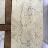 Pull-out tables in golden brass and marble