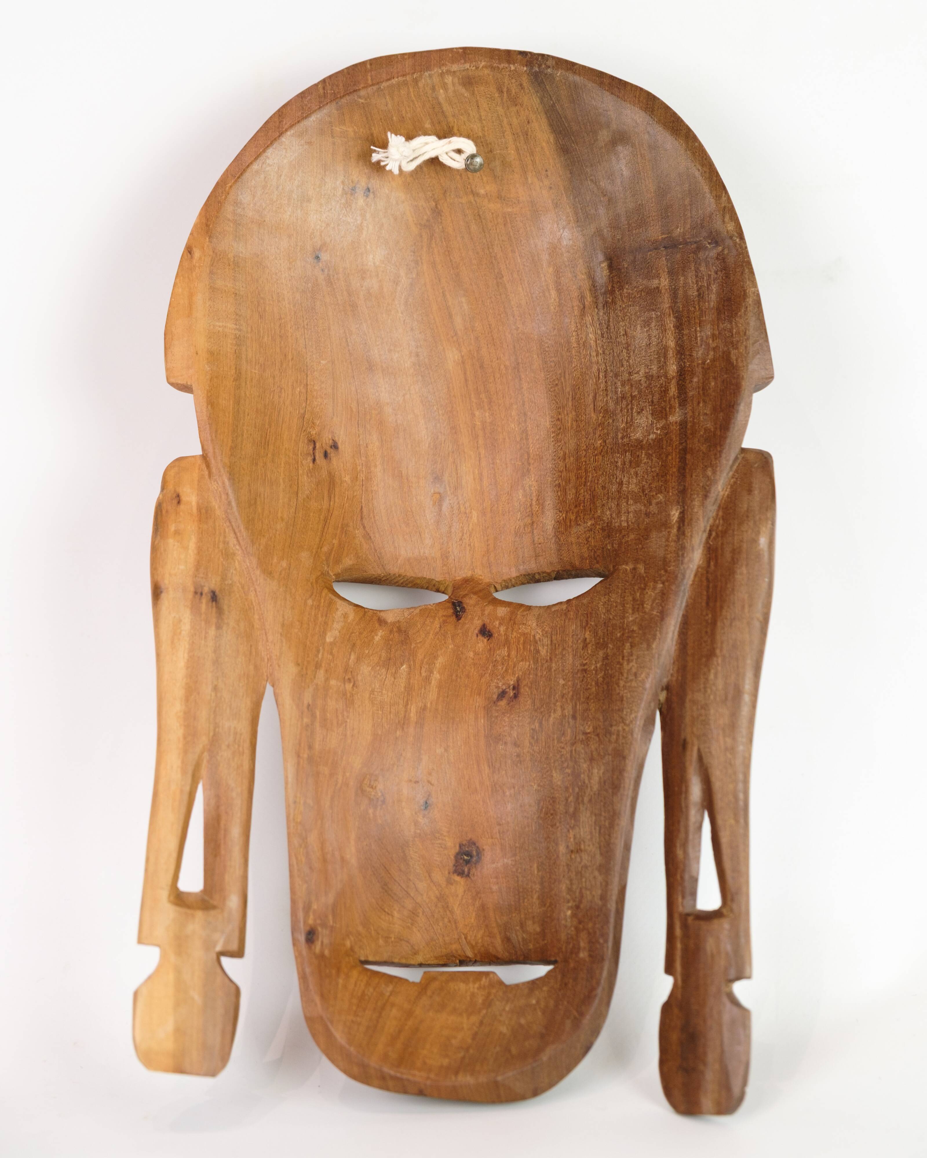 African Mask Hand Carved In Light Wood From West Africa