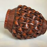 Covered wooden vase covered with woven bamboo