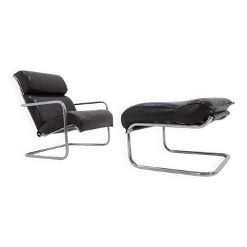 Ensemble fauteuil lounge et repose-pieds en cuir tubulaire chromé - années 1950