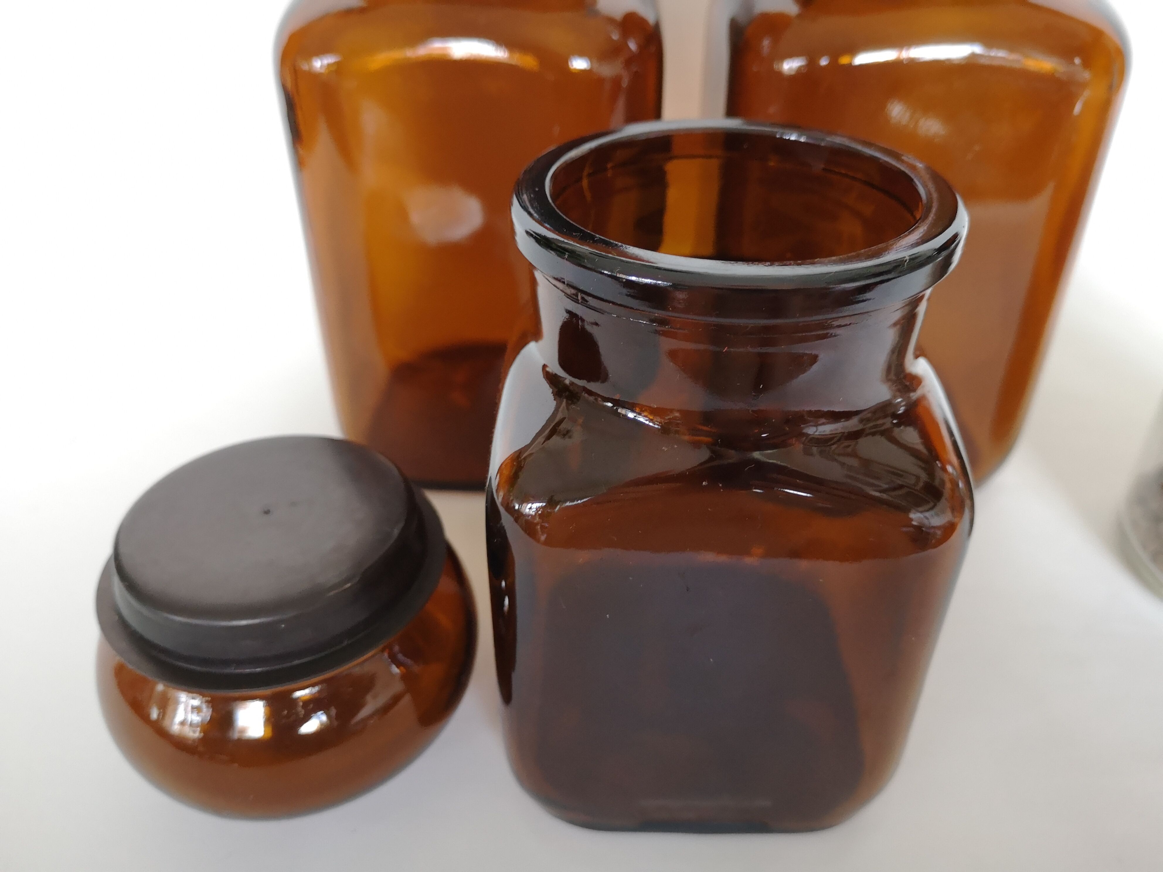 Set of 4 clear and brown glass jars