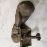 Antique cast iron door knocker in the shape of a 19th century hand