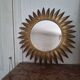 Large sun mirror in gilded metal. 1960