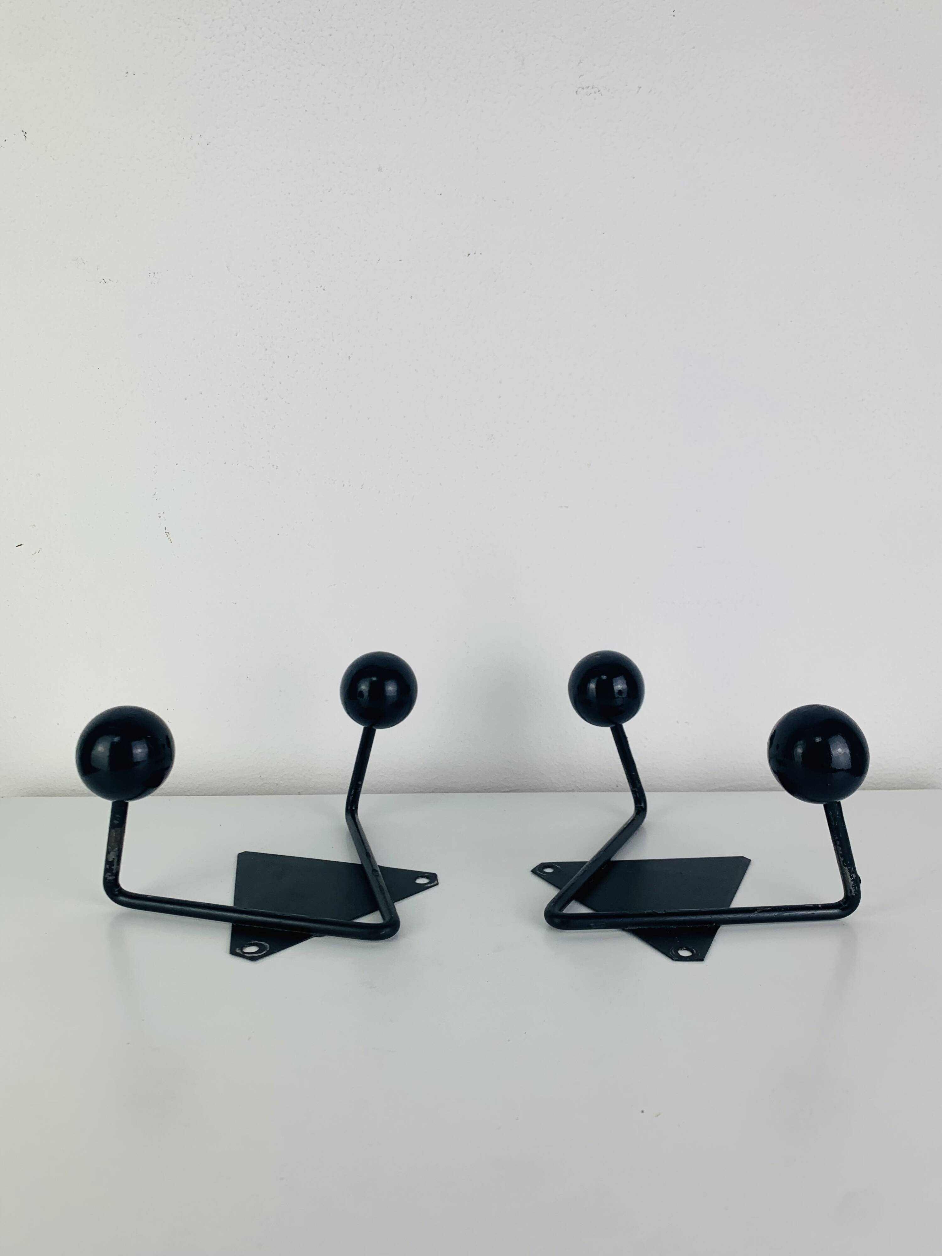Pair of wall hooks from the 1950s, black metal
