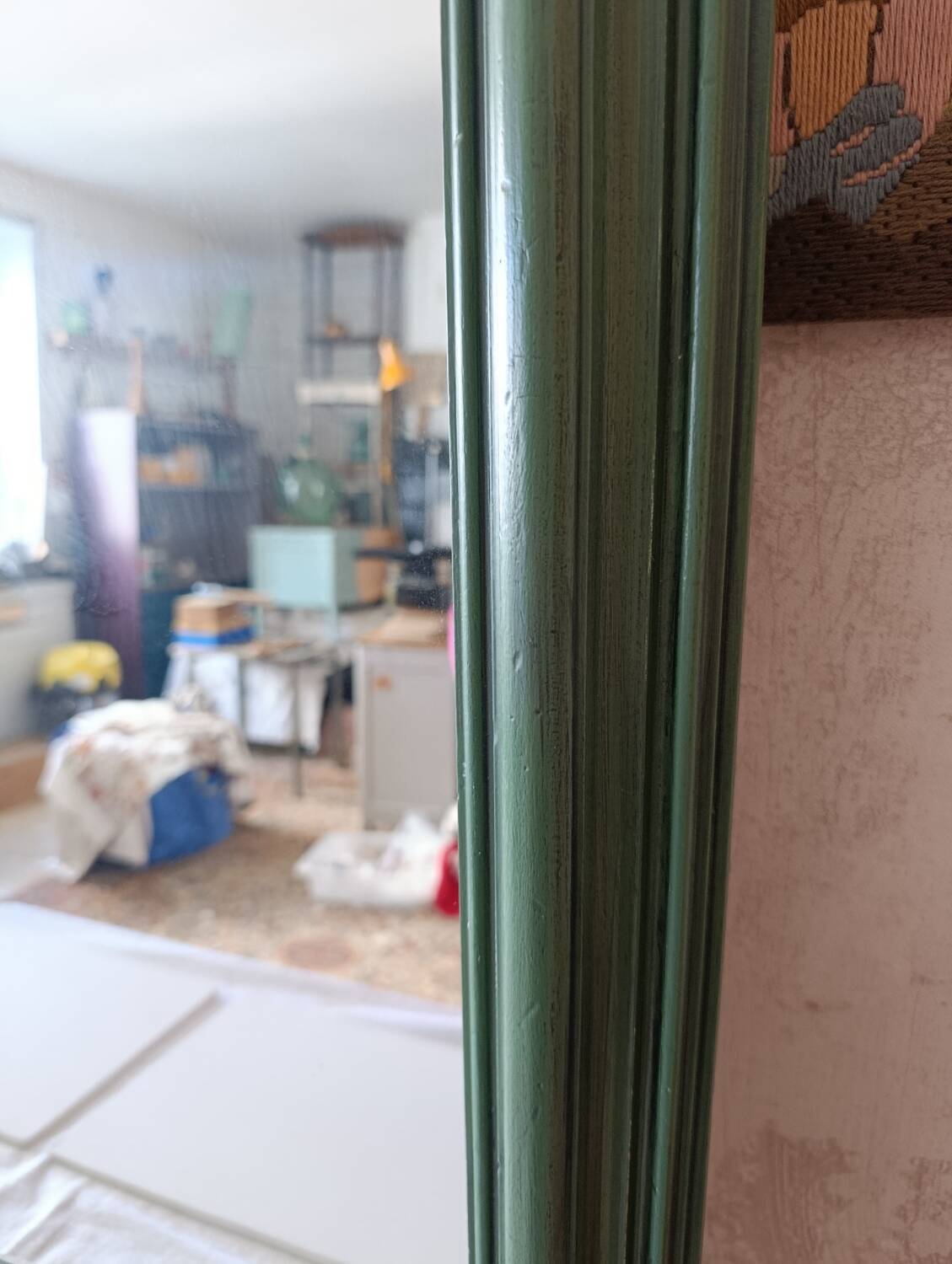 Large dark green rectangular mirror with black patina.