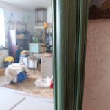 Large dark green rectangular mirror with black patina.