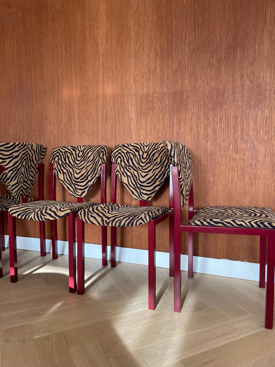 4 red lacquered zebra chairs