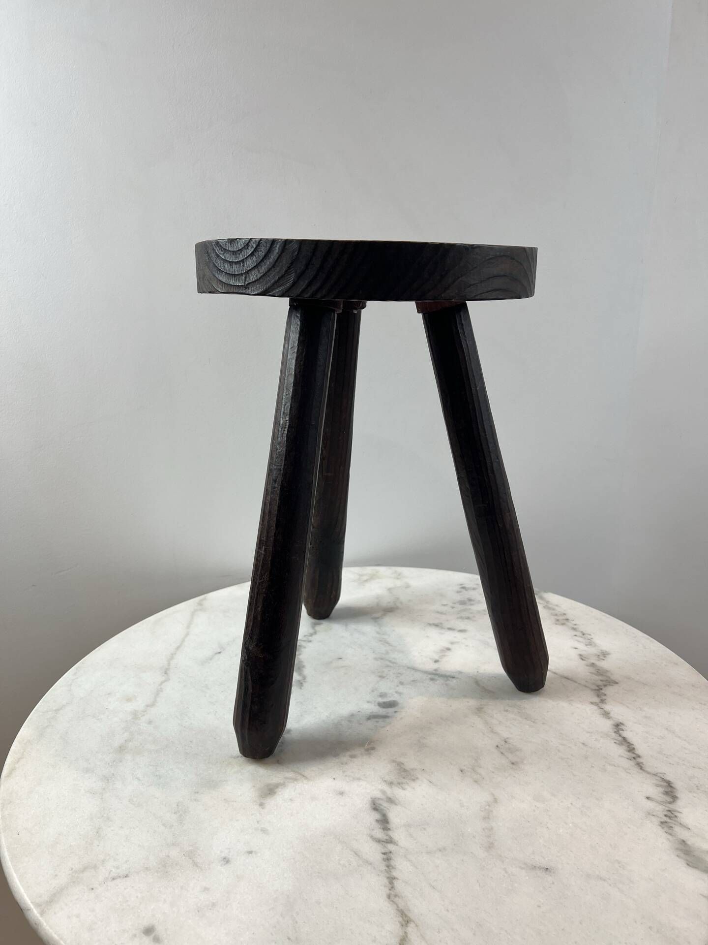 Tripod stool in turned, patinated wood