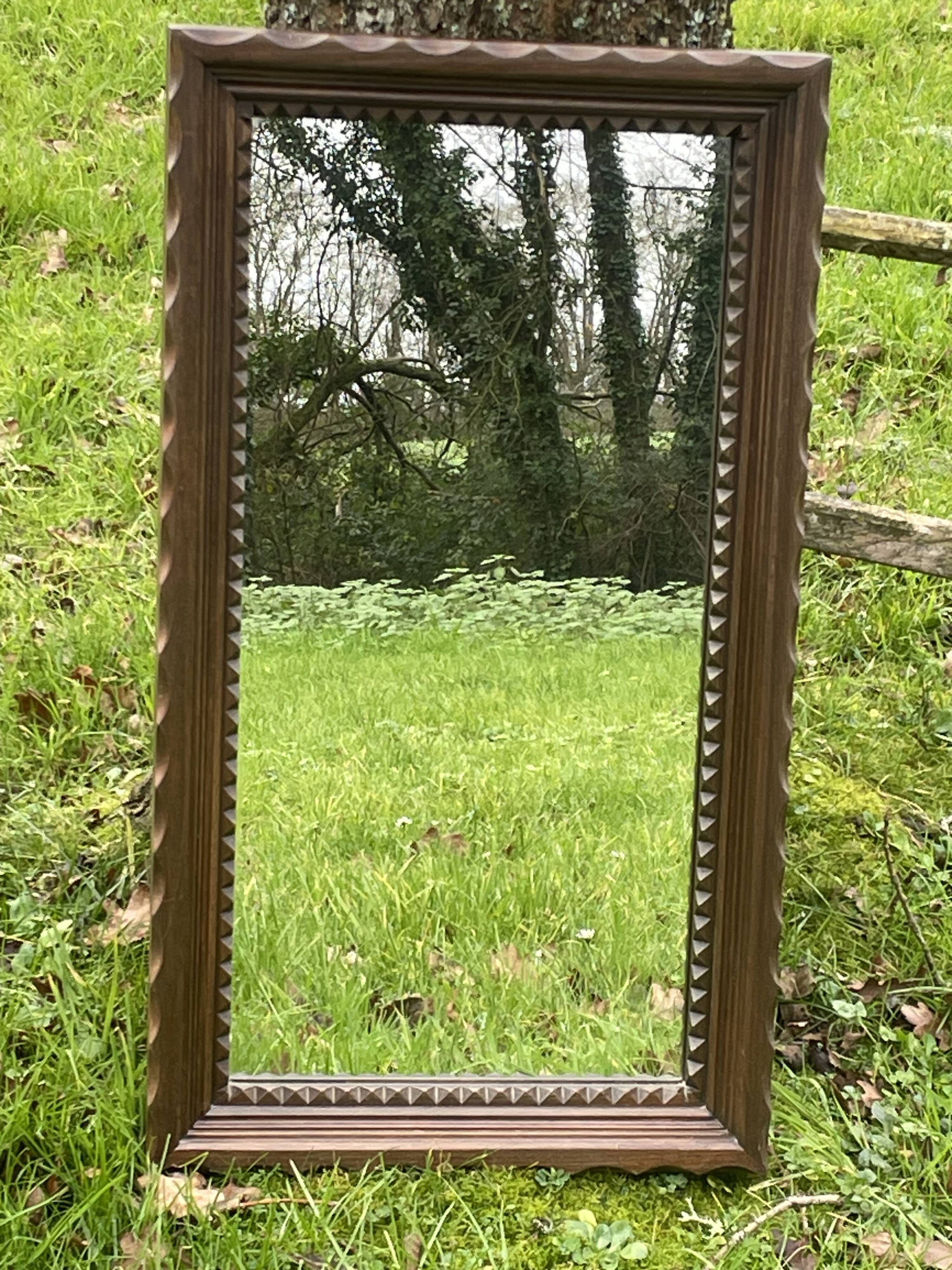 Rustic mirror called brutalist, molded carved natural wood