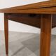 Vintage extendable dining table with tapered legs.