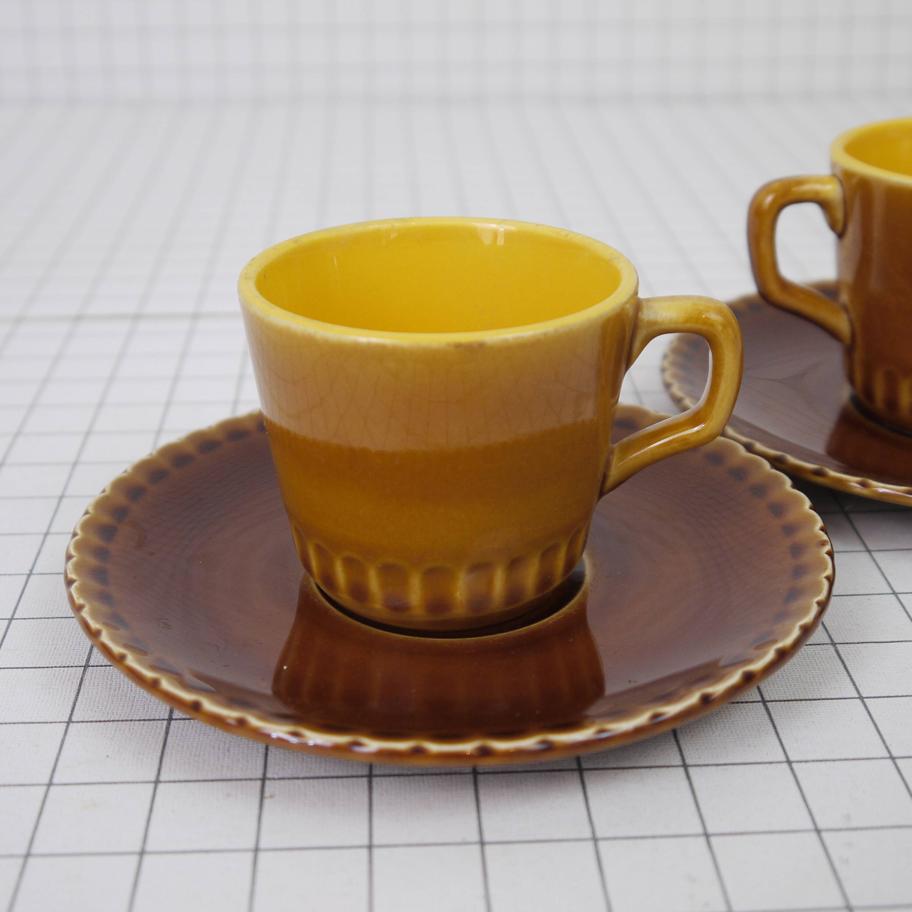 Two Digoin cups and saucers