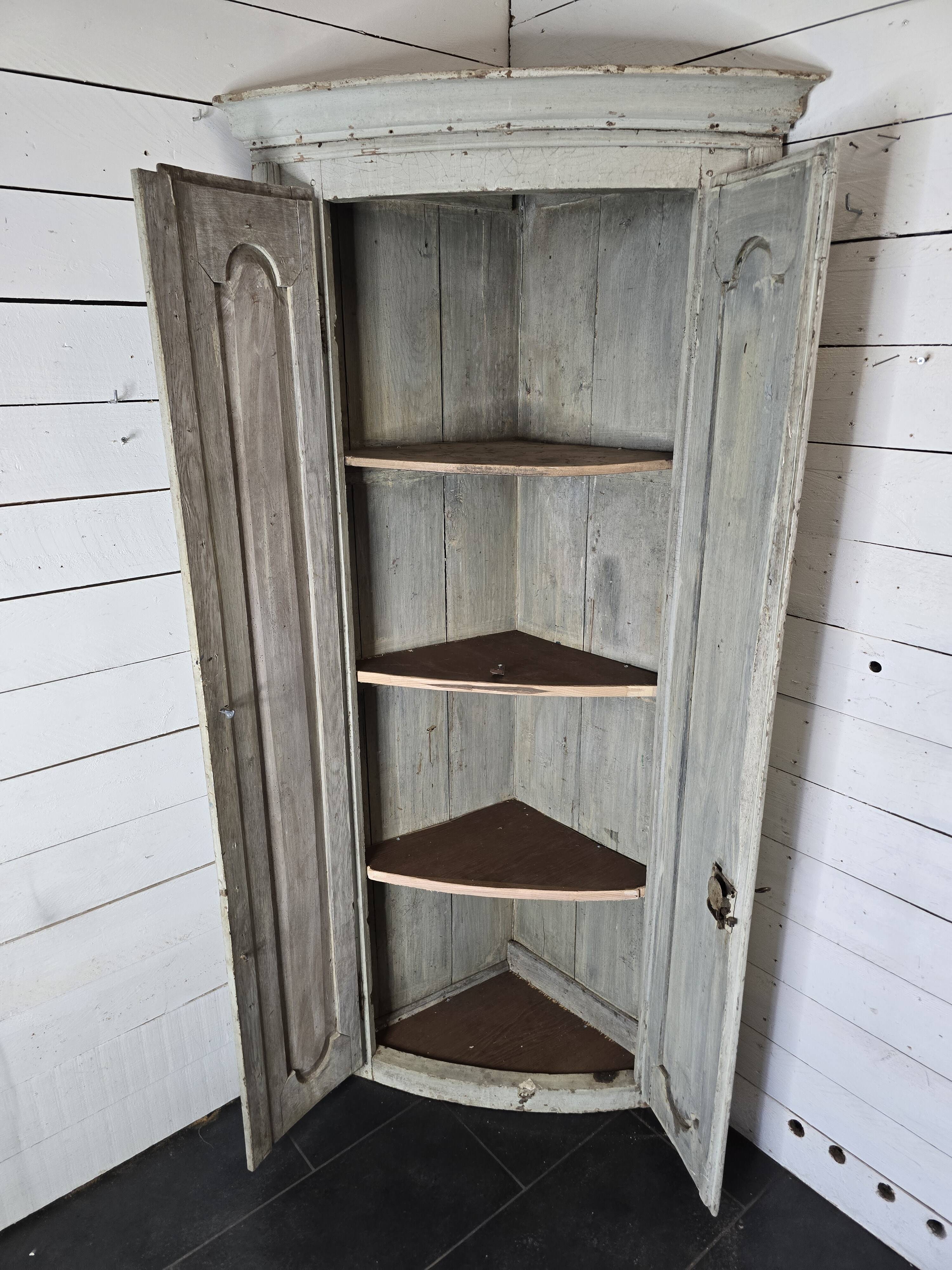 19th century curved corner cupboard in patinated oak