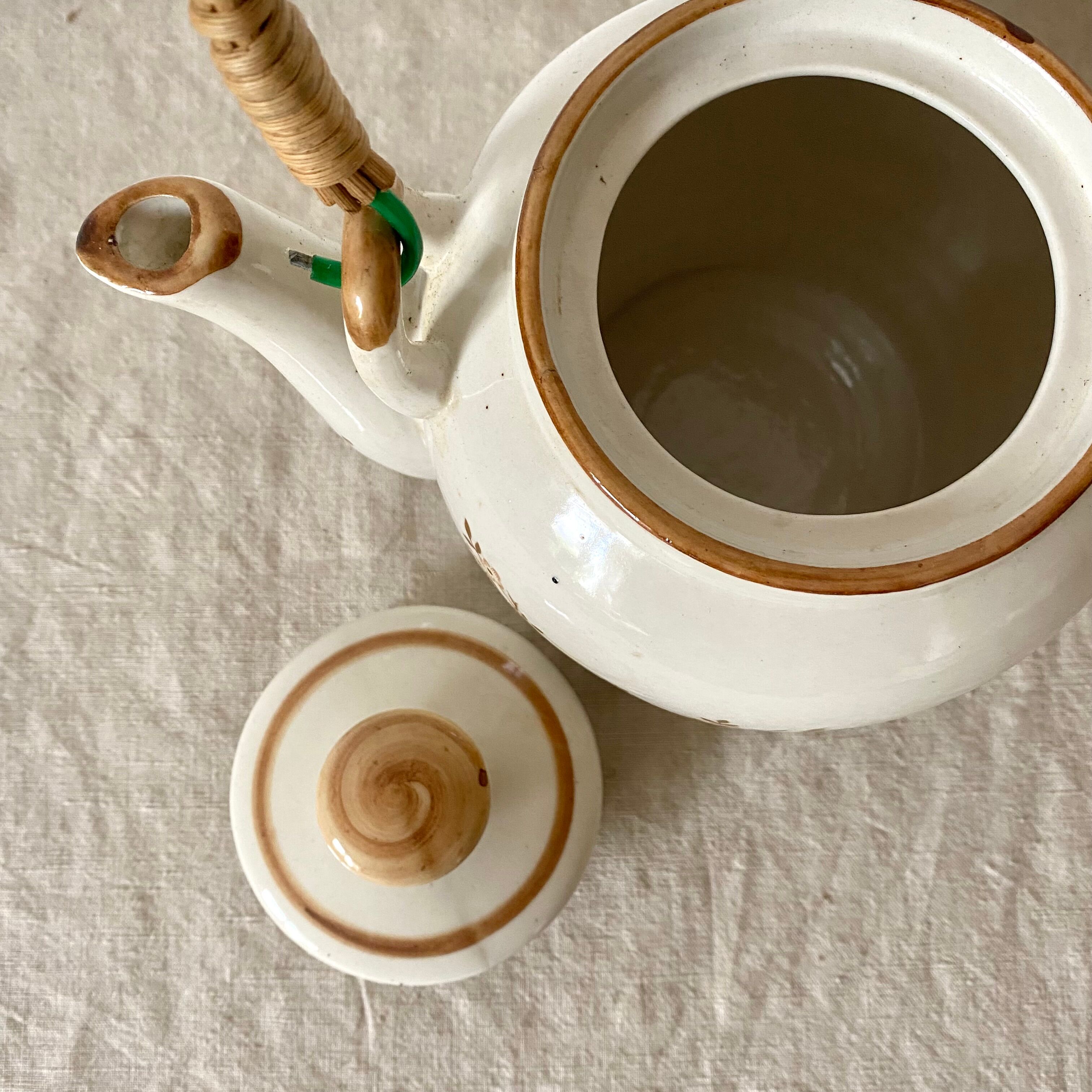 Vintage porcelain and rattan teapot
