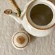 Vintage porcelain and rattan teapot