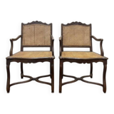 Paire de fauteuils de style Louis XIII os de mouton en cannage.