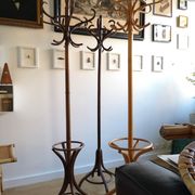 Dark wooden parrot coat holder