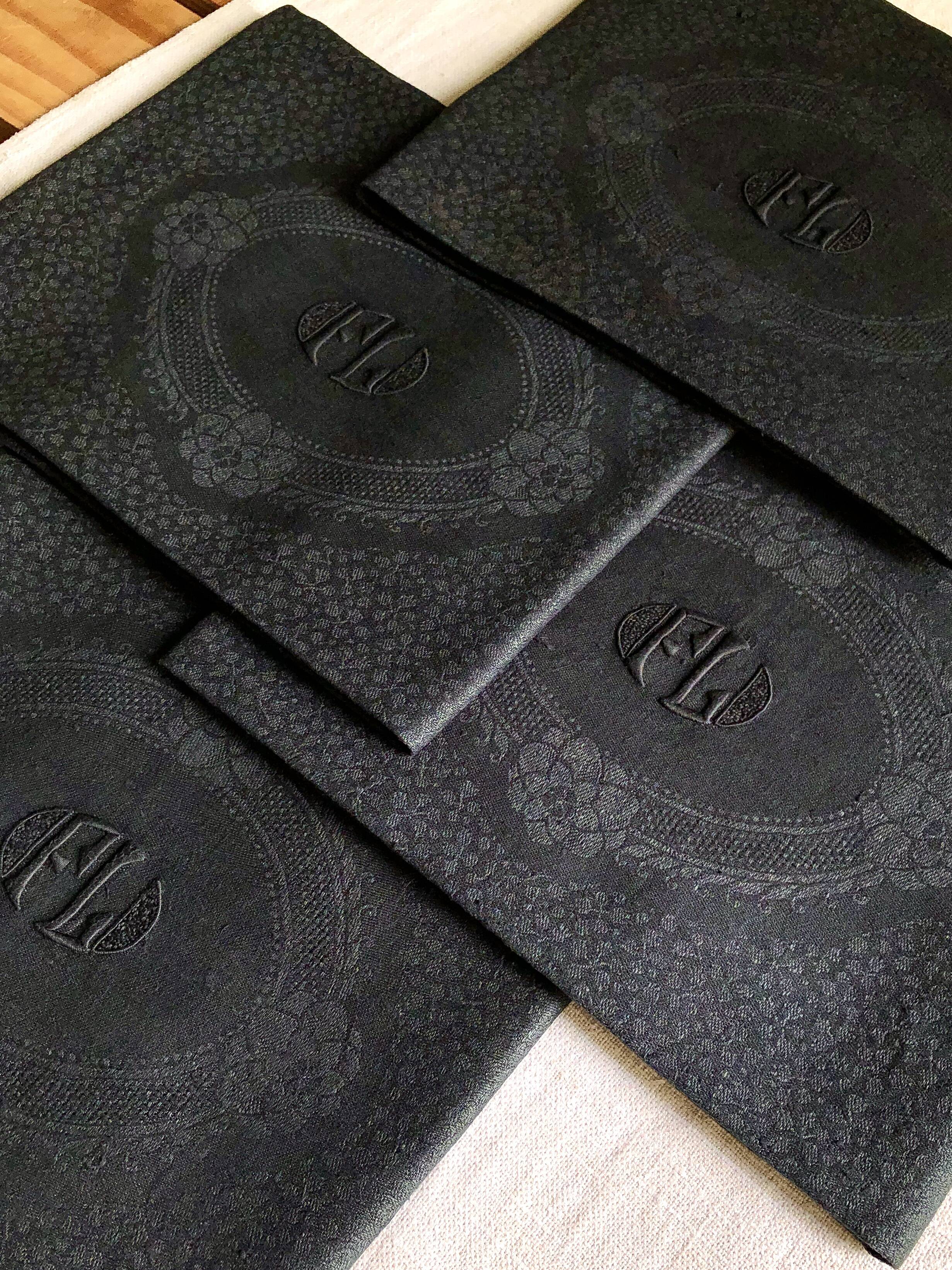 Set of four old damasked towels tinted black