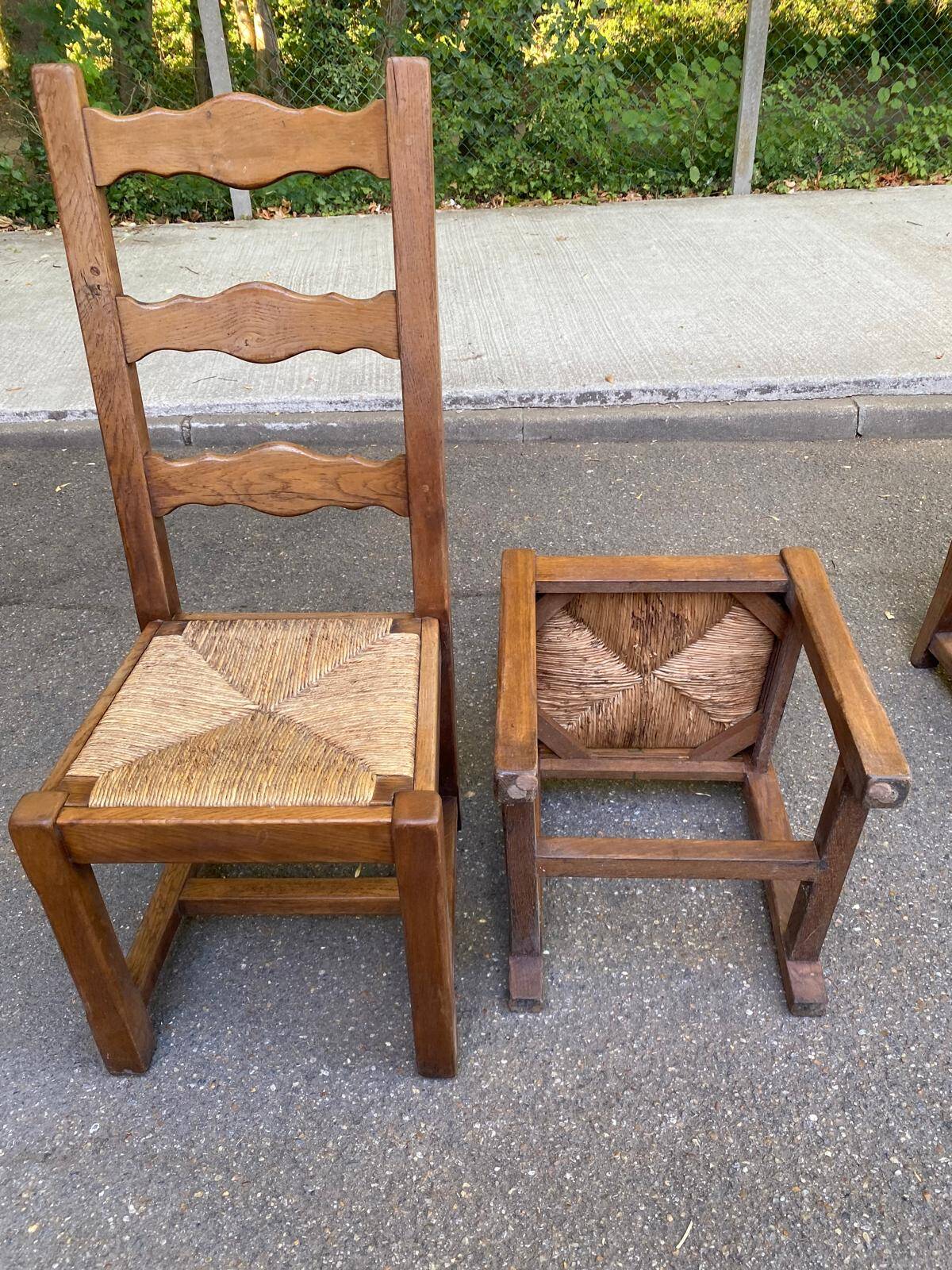 6 solid oak chairs with rush seats in a country style.