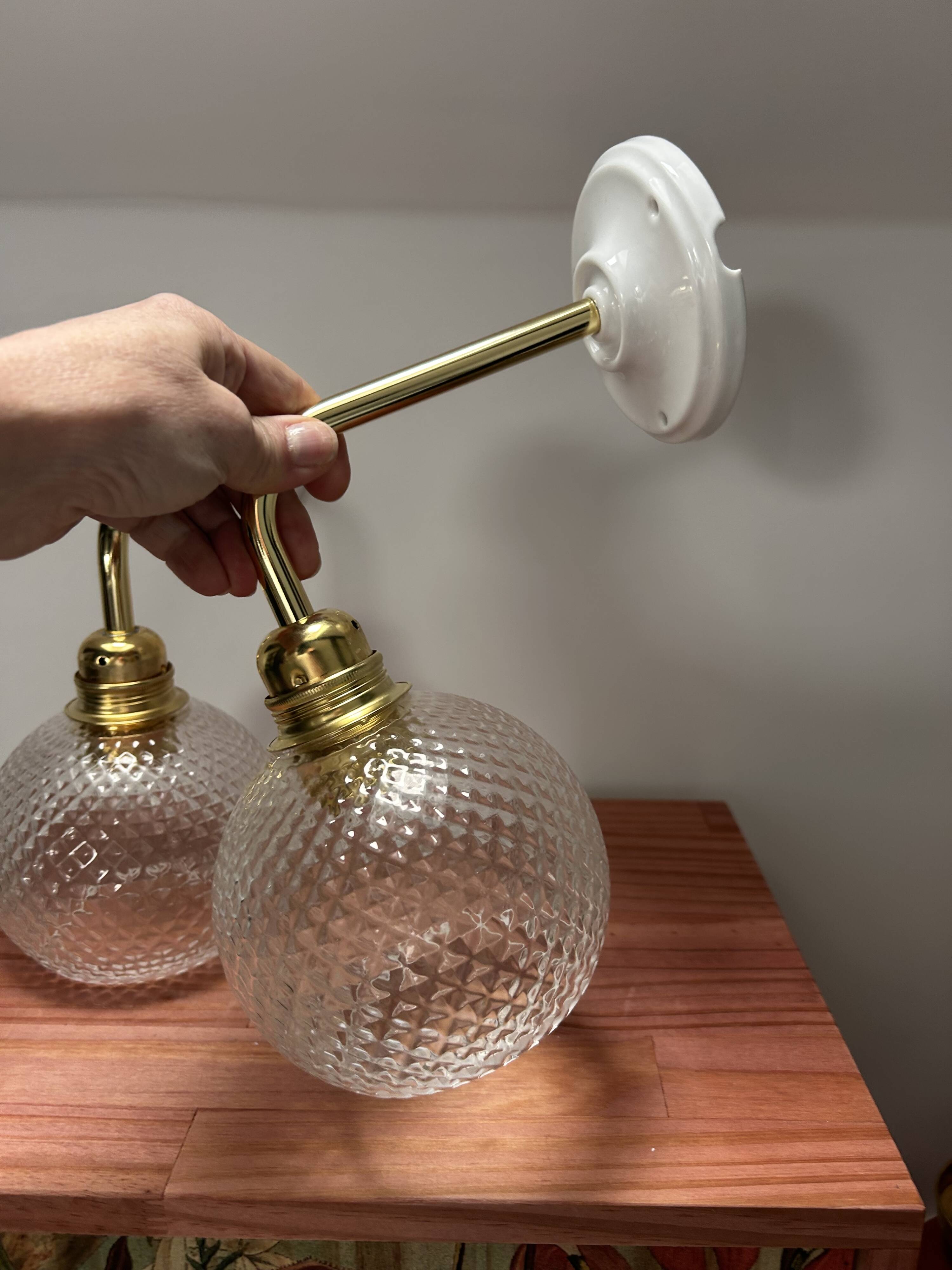 Pair of chiseled glass wall sconces