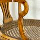 Fauteuil bas anglais en bois ajouré à assise cannée, 19e siècle