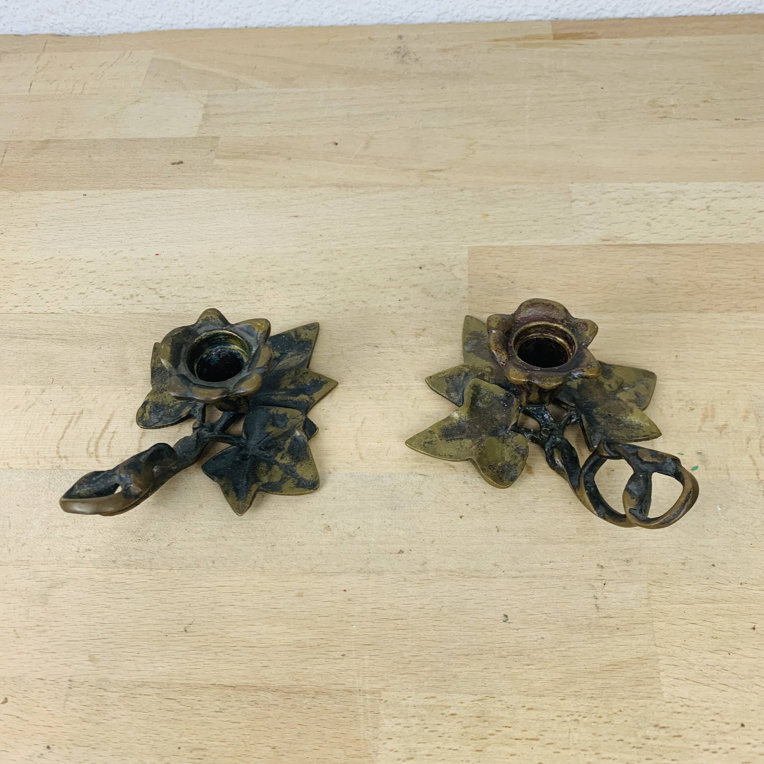 Pair of brass flower candlesticks, cellar