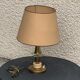 Table lamp in gilded metal, bakelite and antique plexiglass