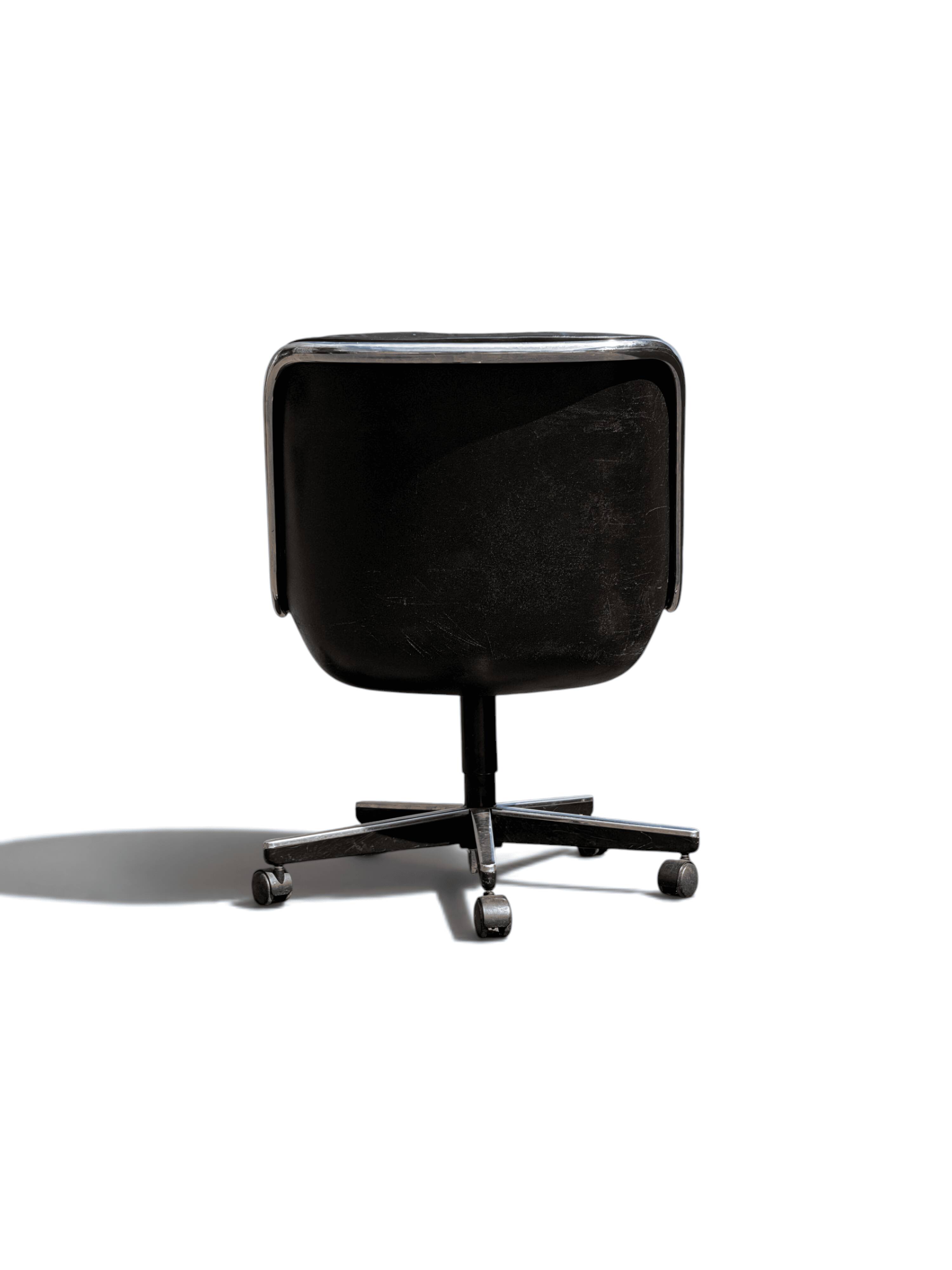 Charles Pollock Knoll office chair in black leather without armrests.