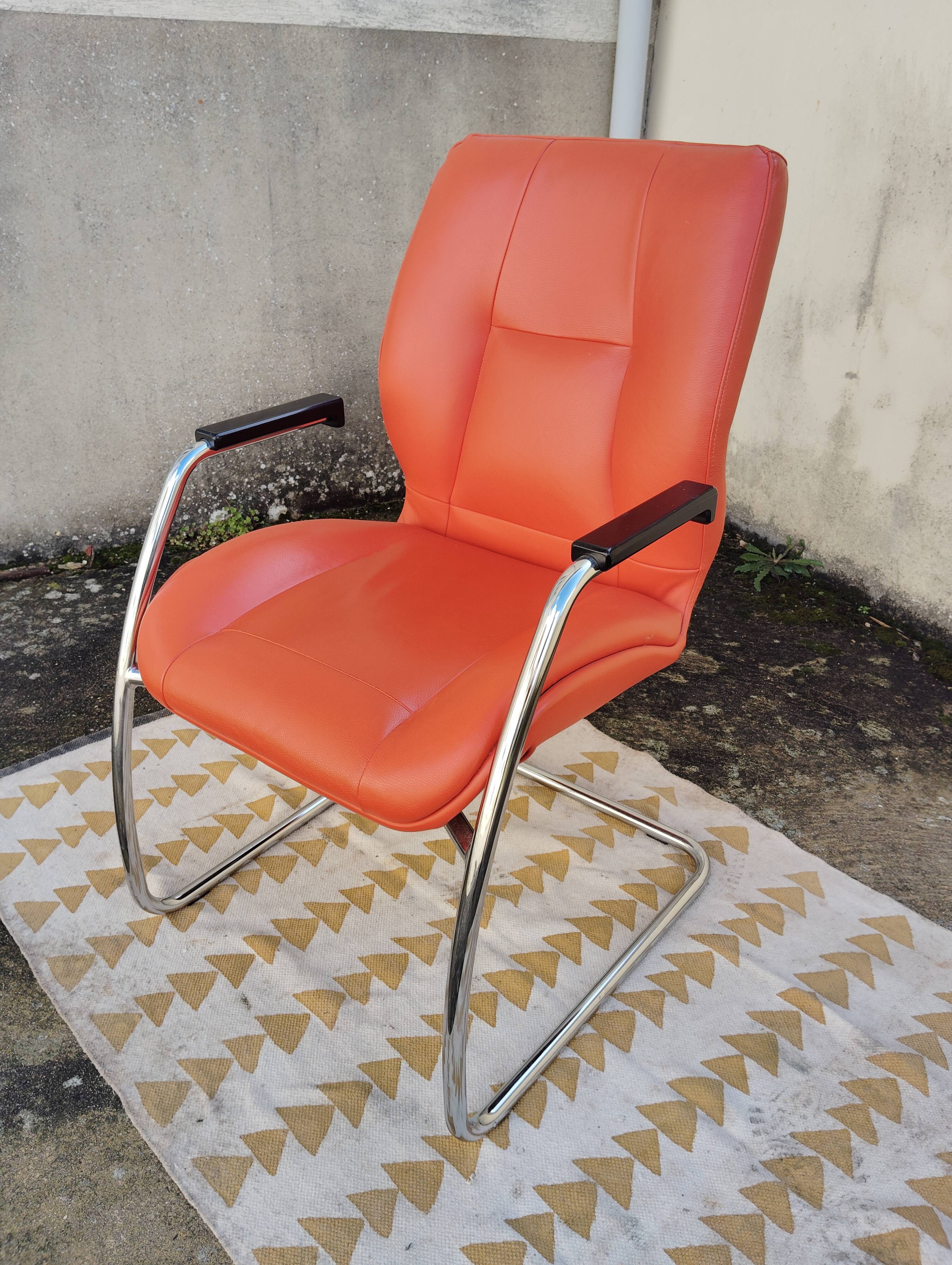 Orange leather cantilever tubular armchair