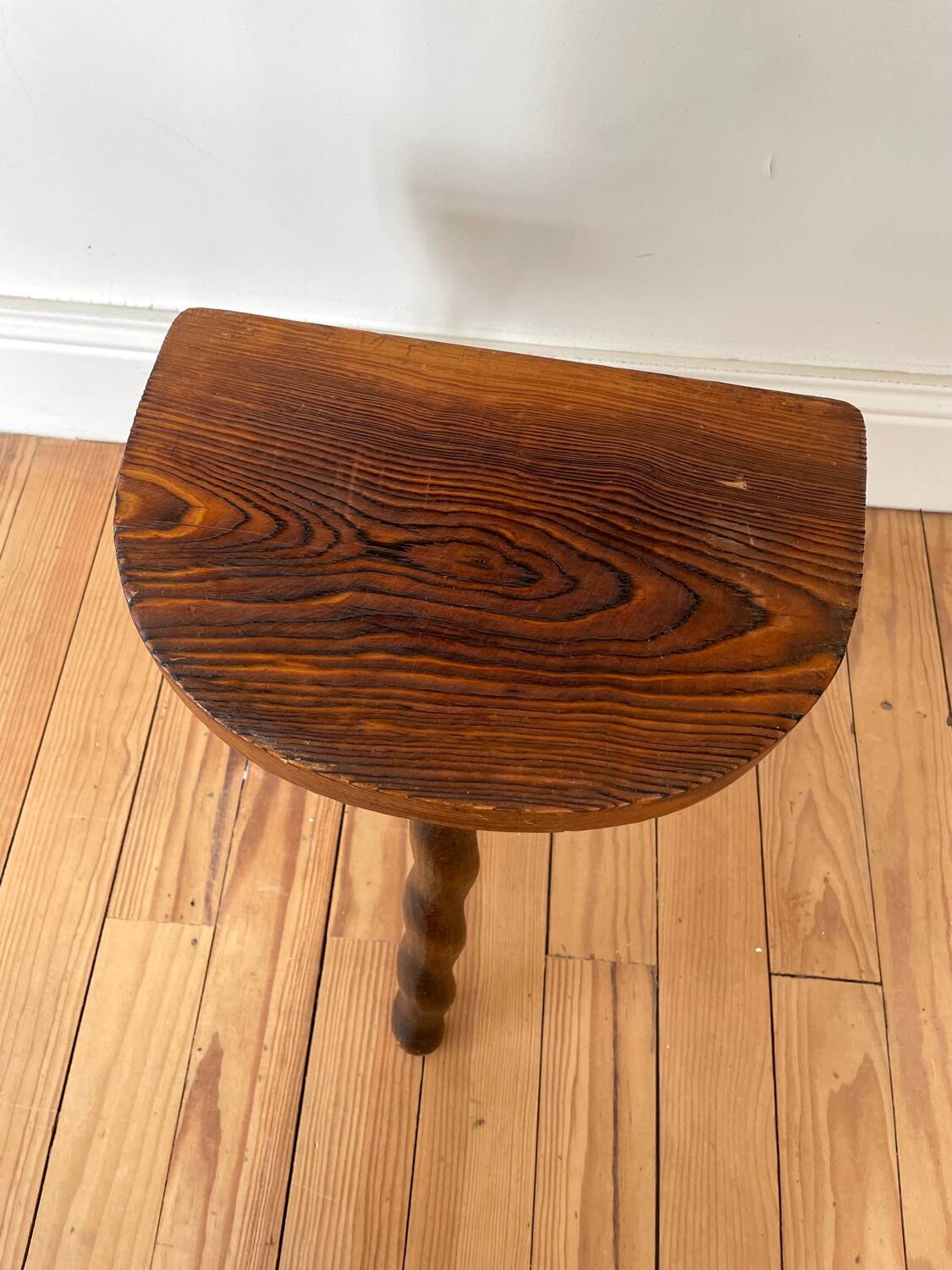 Vintage wooden half-moon tripod stool with twisted legs