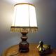 Rustic turned wood table lamp with vintage leather shade