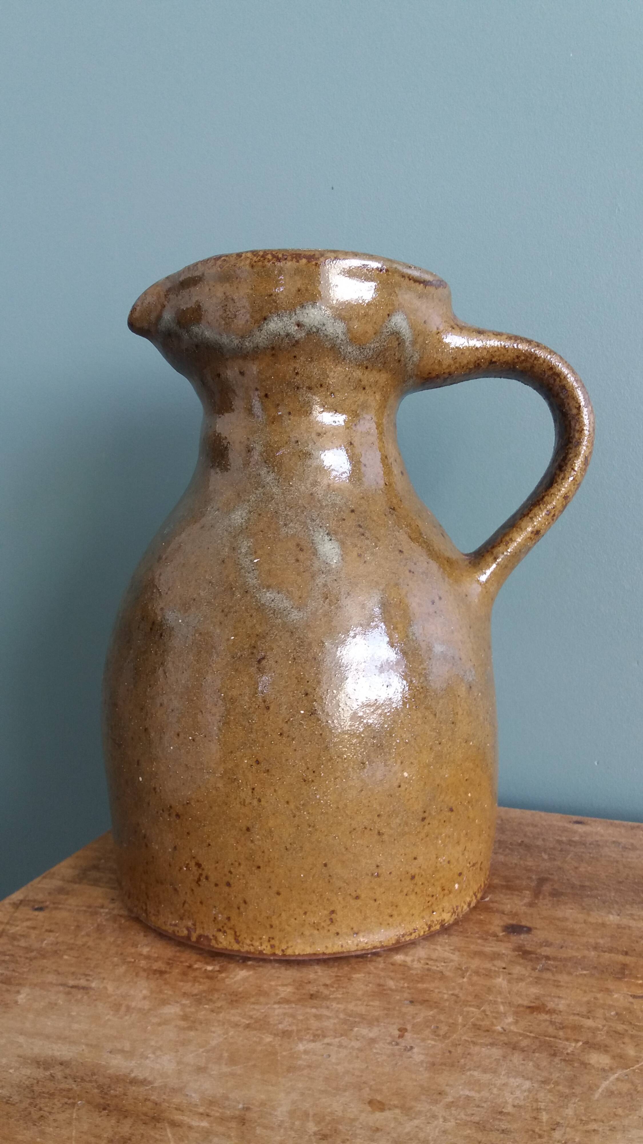 Rustic stoneware jug, chic countryside.