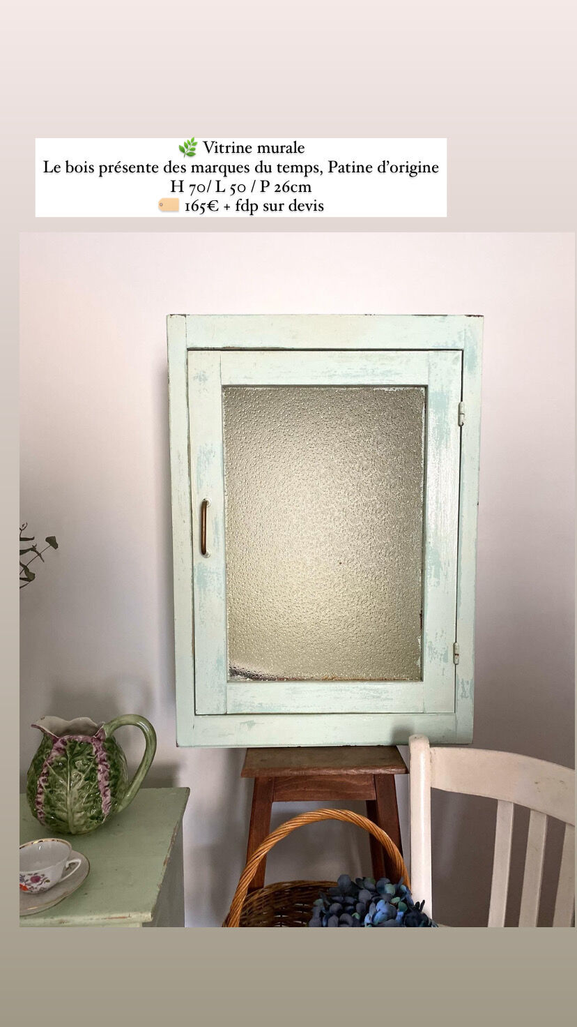 Old medicine cabinet in mint green patinated wood
