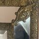 Mirror with brass repoussé frame