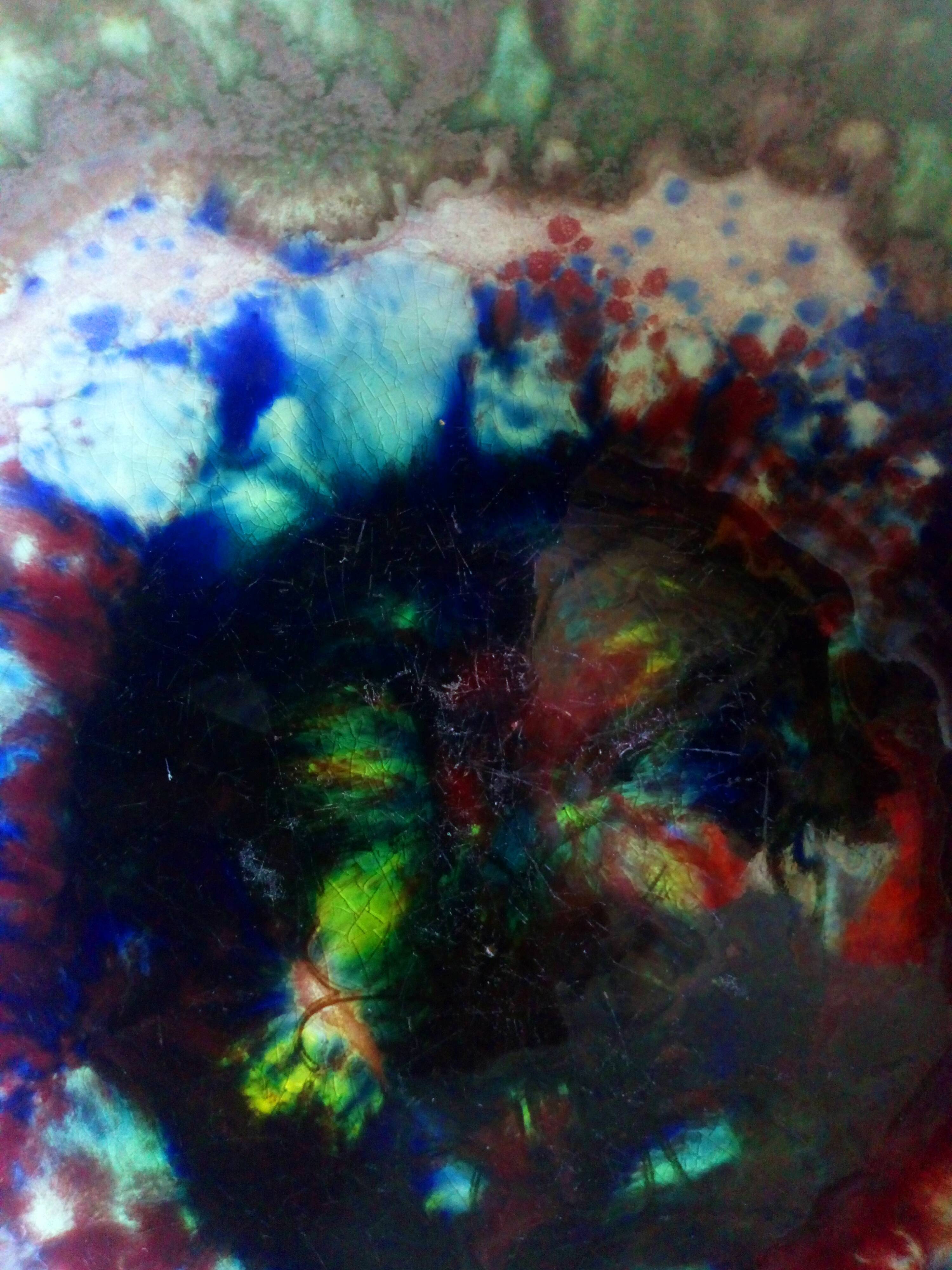 Seven plates of potter with multicolored enamels