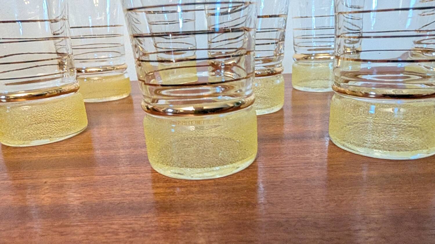 70s vintage glass with gold decoration and a speckled base.