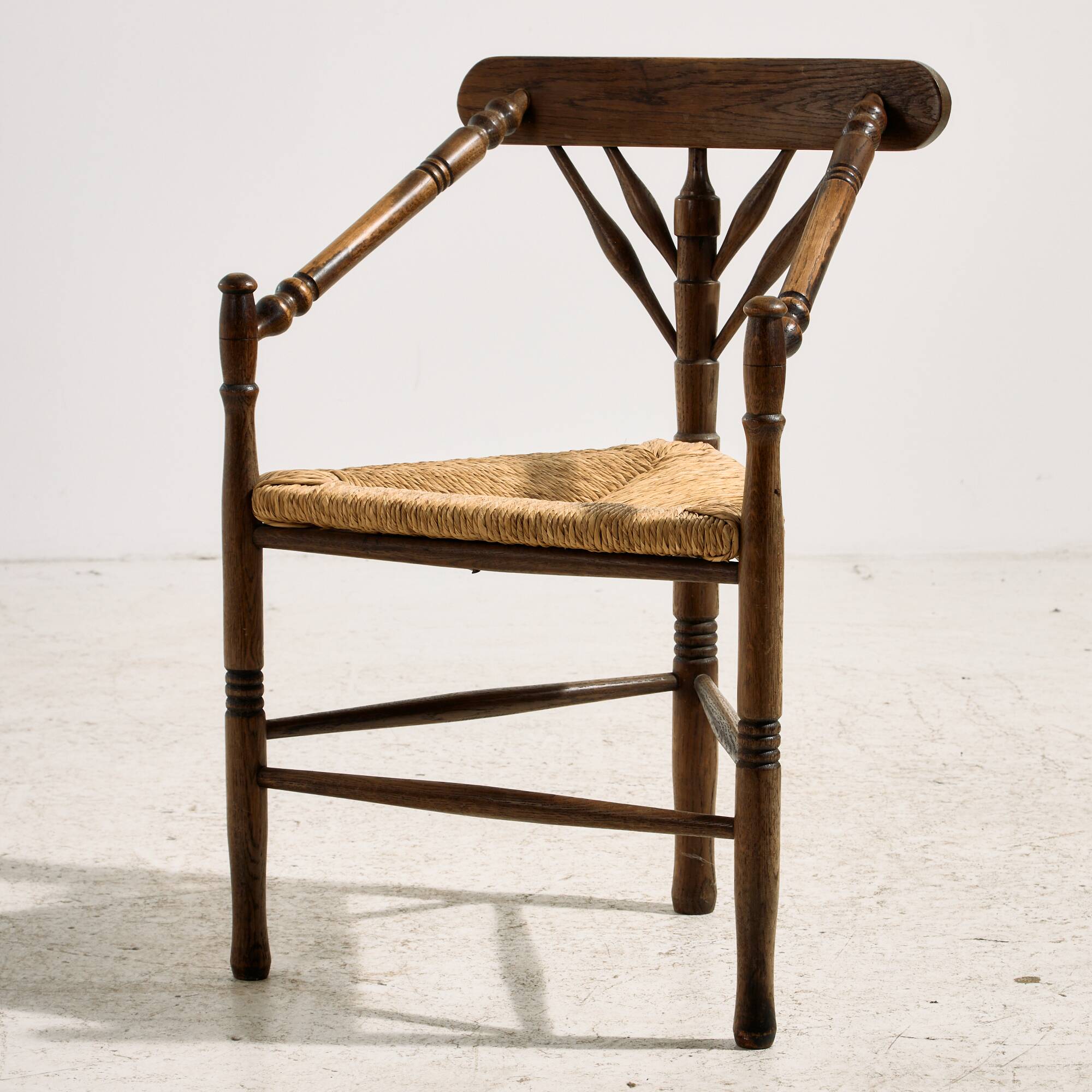 Oak armchair with three legs