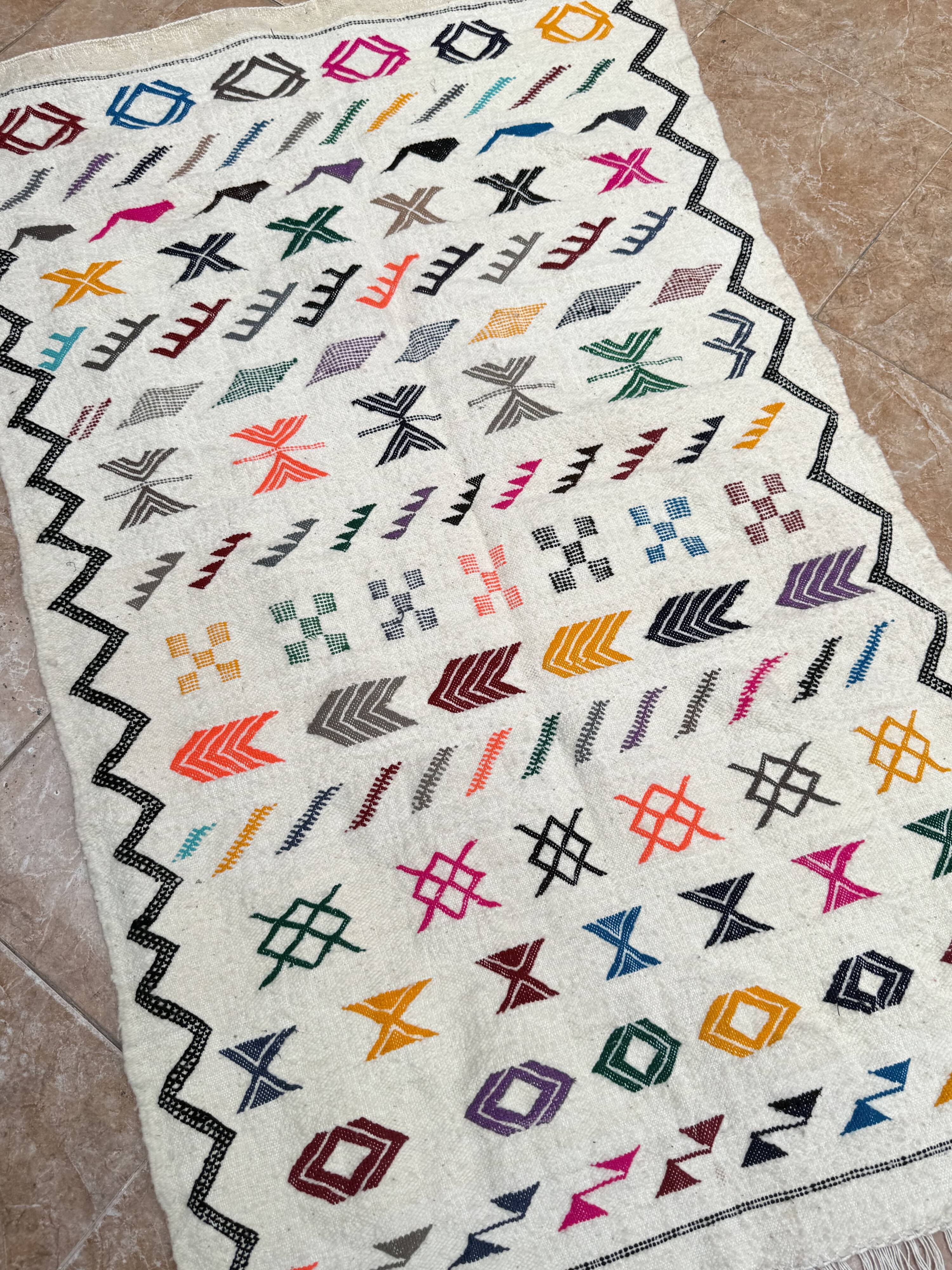 Handwoven Berber kilim rug: small Moroccan decorative rug.
