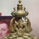 Fireplace trim clock and adornment of antique bronze candelabra